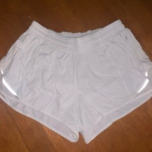 White Lululemon shorts. Size 6 but fits like 2.